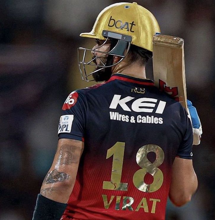 vk with bat on shoulder